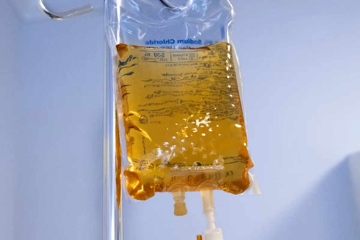 An IV infusion bag hanging ready in the IV suite at Healing Advanced Solutions